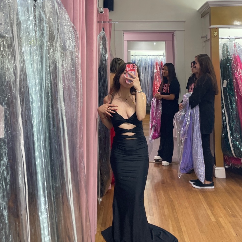 Beautiful black prom dress. Never worn out, my prom got canceled.